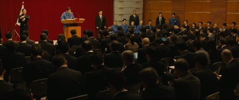 A conference is held prior to Godzilla's arrival