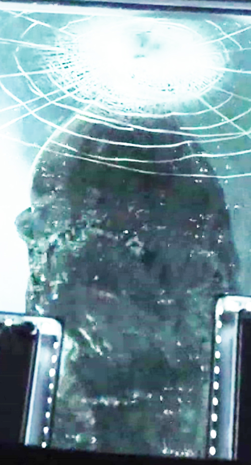 Daniels fighting xenomorph, temple surrounding structure visible